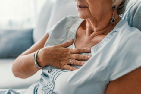 women holding chest